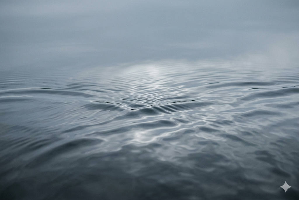 Still water surface with subtle ripples in cool light